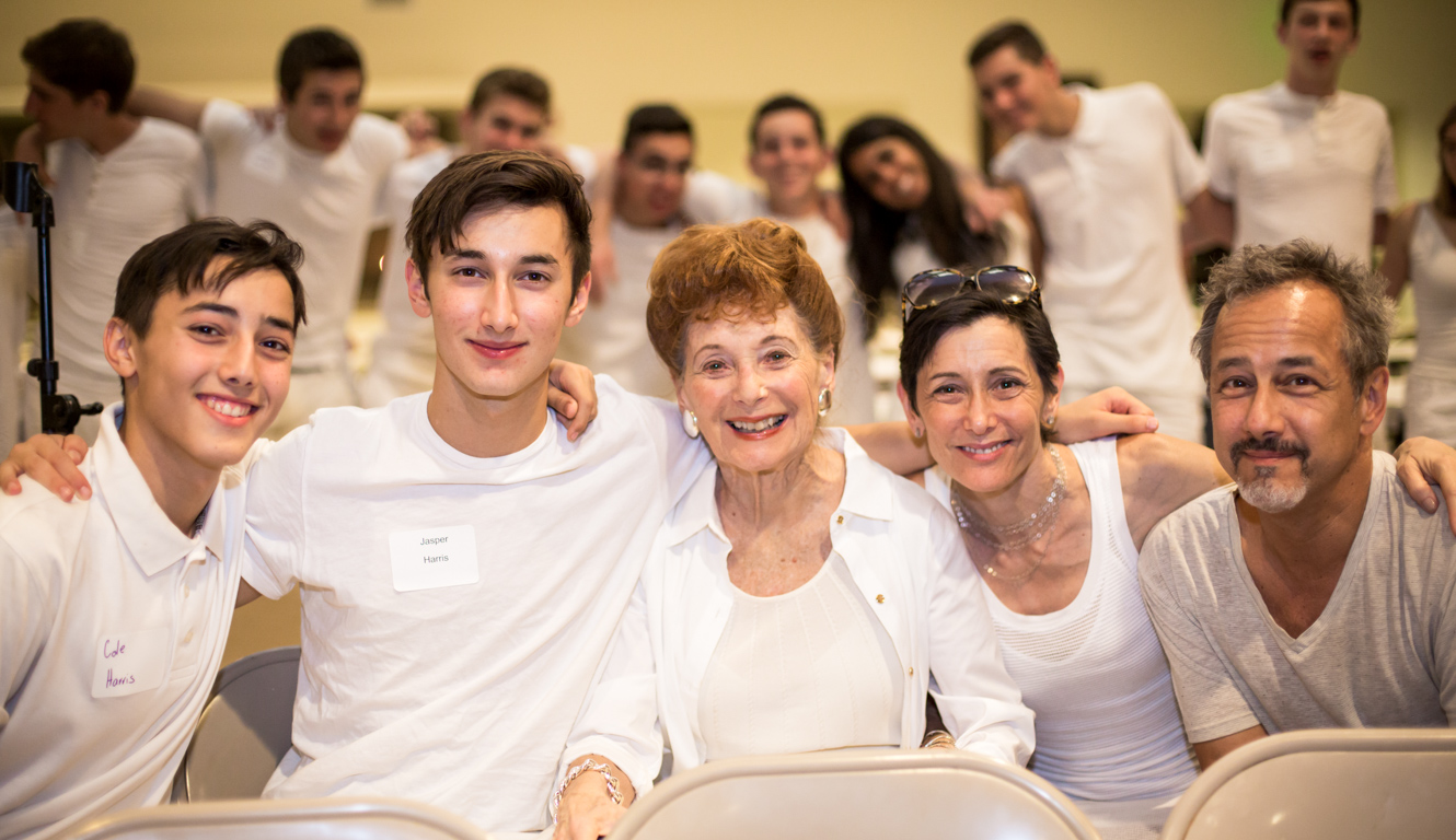 Campers and family dressed in white for shabbat