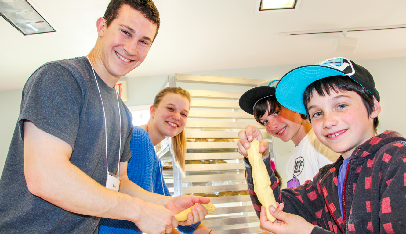 Campers making bread