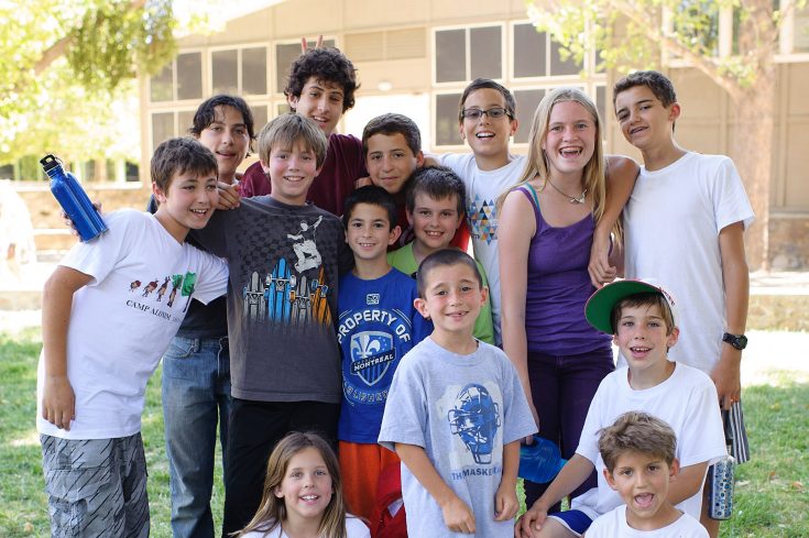 Group of campers smiling together for a group photo