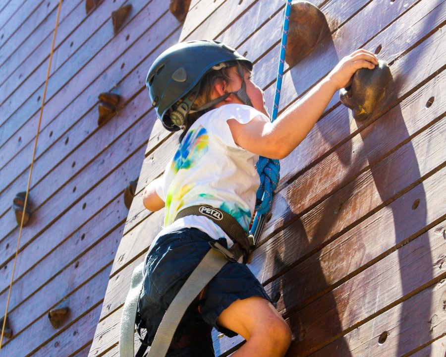 Camper climbing the rock wall