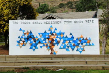 ART MURAL THAT SAYS "THE TREES SHALL REMEMBER YOUR BEING HERE"